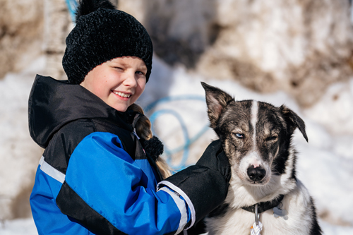 Boy With Dog Sled at Apukka Resort - Credit: Apukka Resort