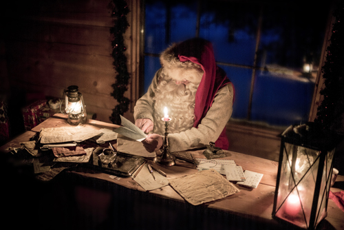 Santa Claus by candlelight - Credit Kimmo Syvari and Visit Finland